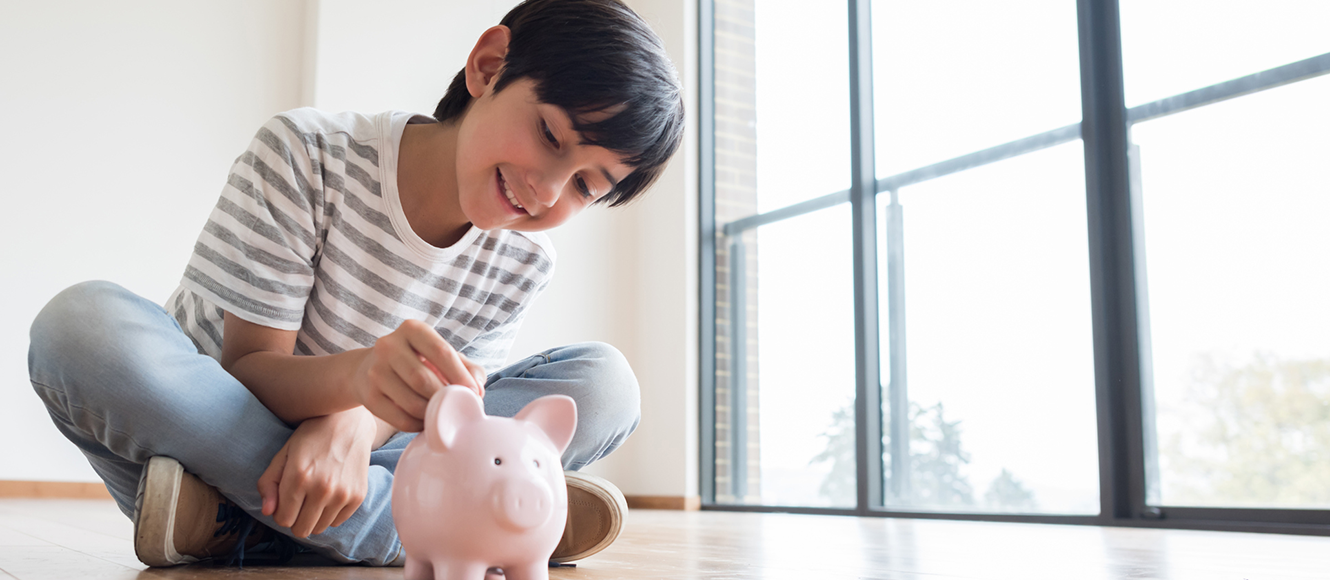 Boy with his piggy bank.