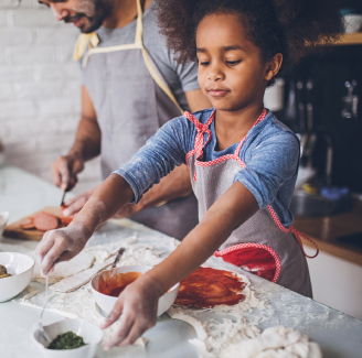 Little girl baking with her father