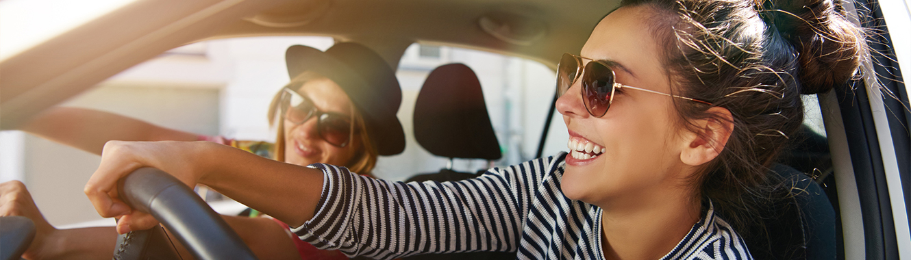 Young woman driving.