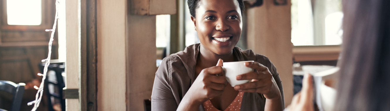 A woman drinking cup of coffee