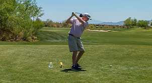 Golf Classic Player swinging. 