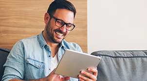 Man reading from tablet.
