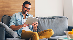 Man reading from a tablet.