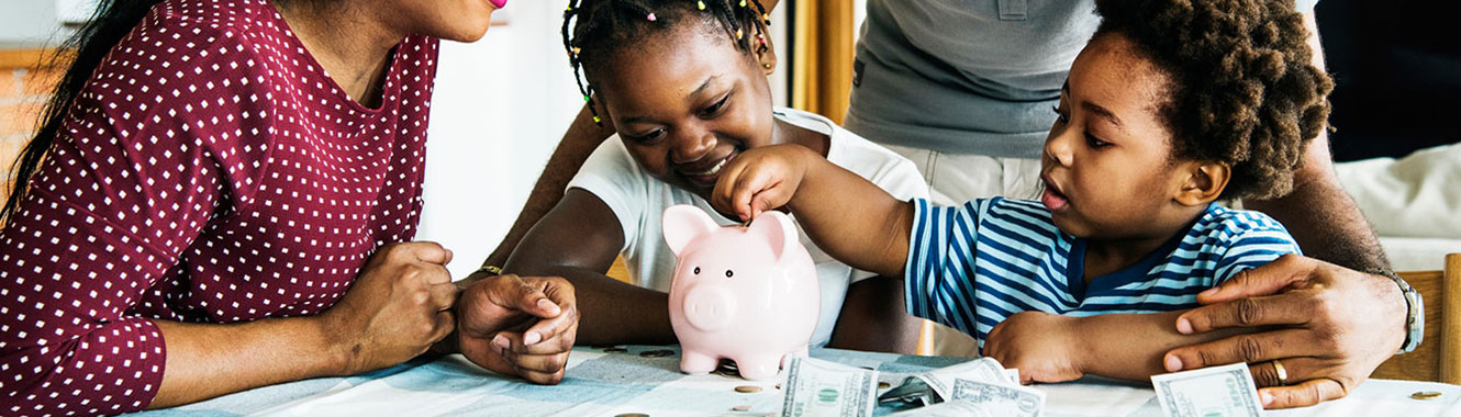 Children filling up their piggy banks