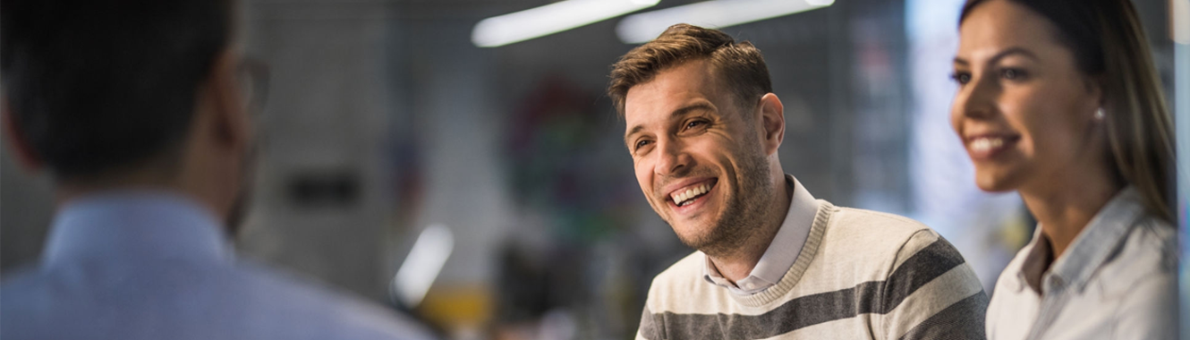 Couple speaking to representative.