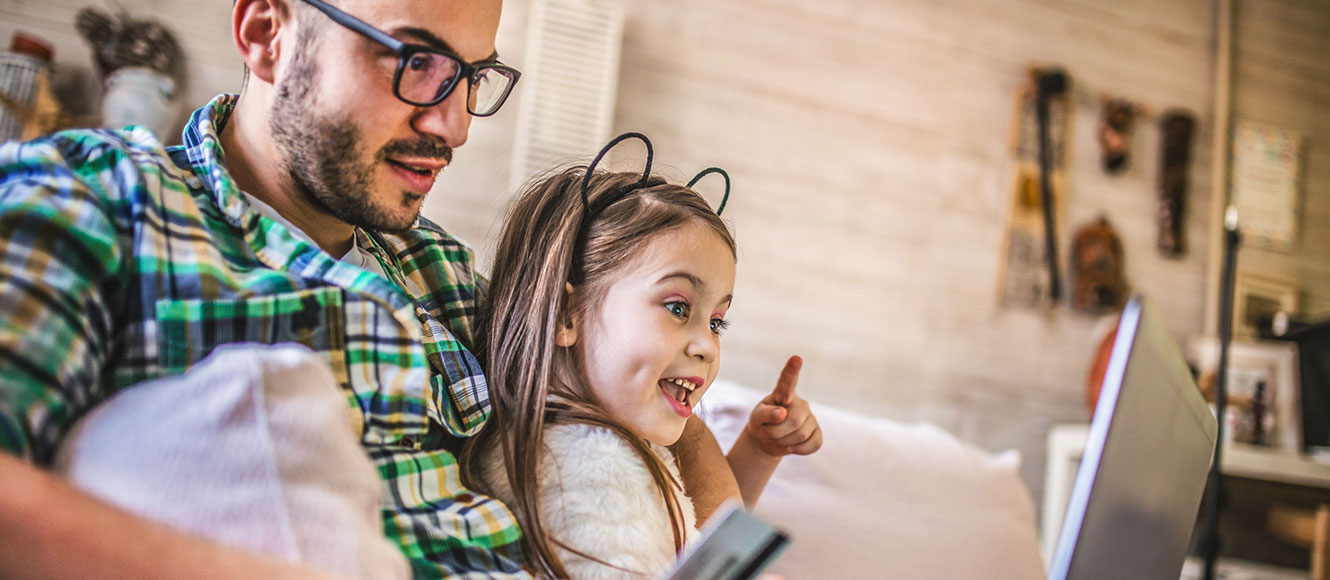 Dad and daughter online shopping.